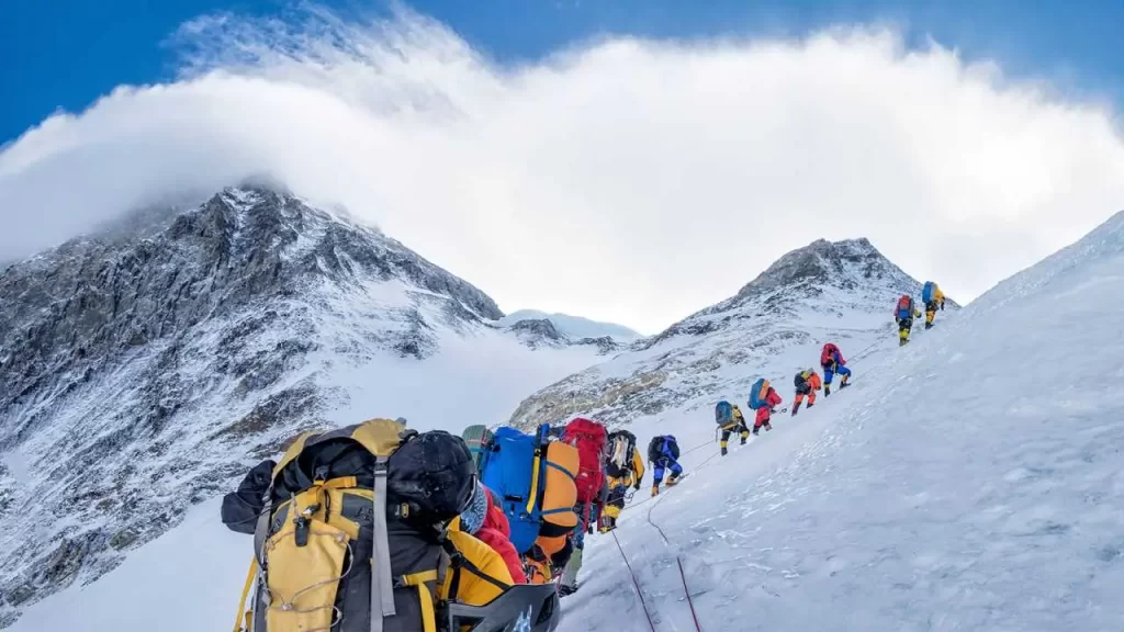 Climbers queuing up to summit Mount Everest.